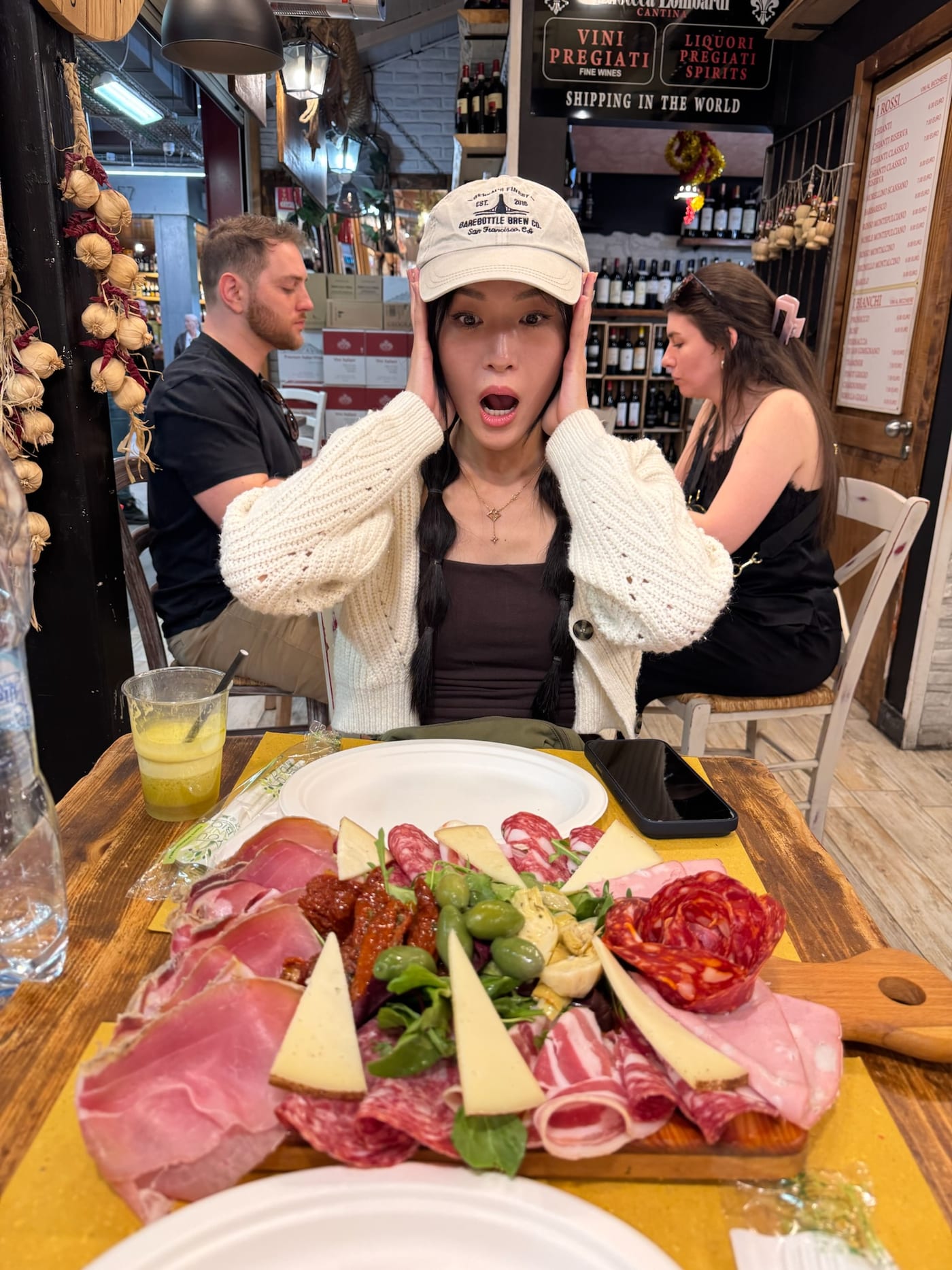 Reaction at a table with charcuterie at Mercato Centrale in Florence