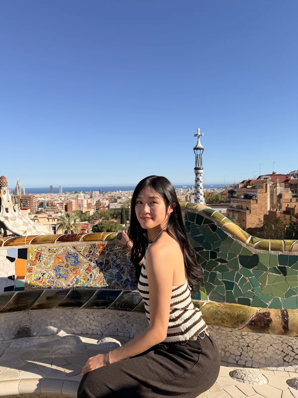 The colorful mosaic terrace at Park Güell overlooking Barcelona