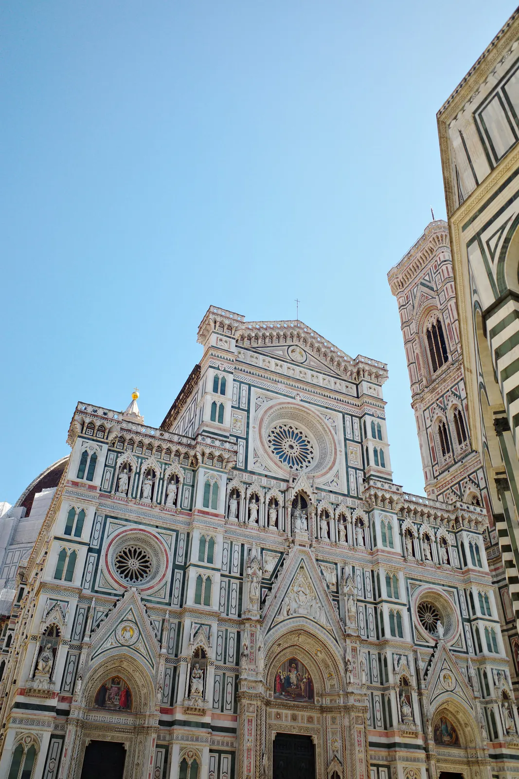 Green, pink and white marble facade and dome of the Cathedral of Santa Maria del Fiore in Florence
