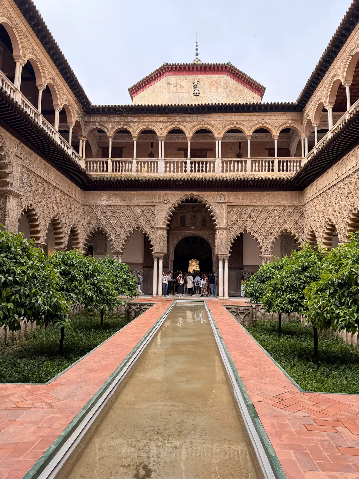The Patio de las Doncellas and its long reflecting pool inside the Royal Alcázar of Seville