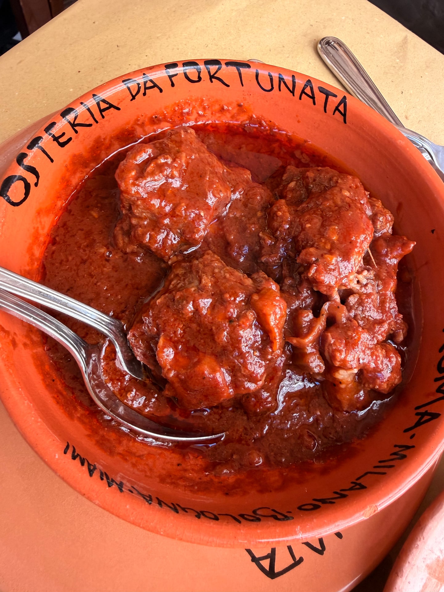 Braised oxtail in tomato sauce at Osteria da Fortunata in Rome