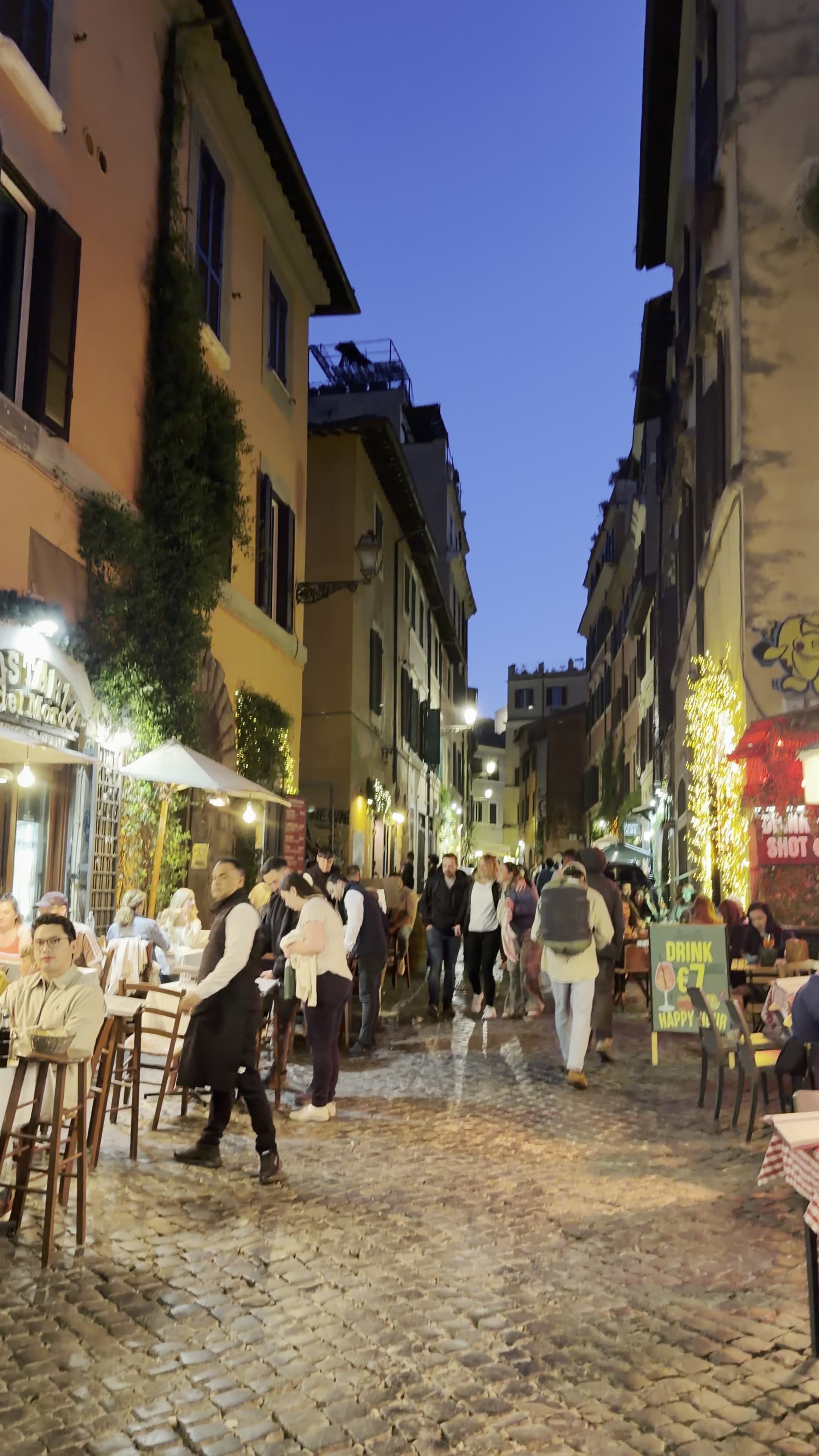 The bar area at CULTO in Trastevere with warm lighting