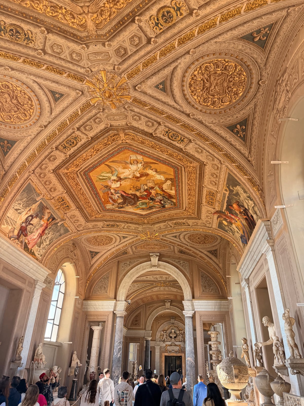 Decorated Vatican Museums corridor with painted ceiling details