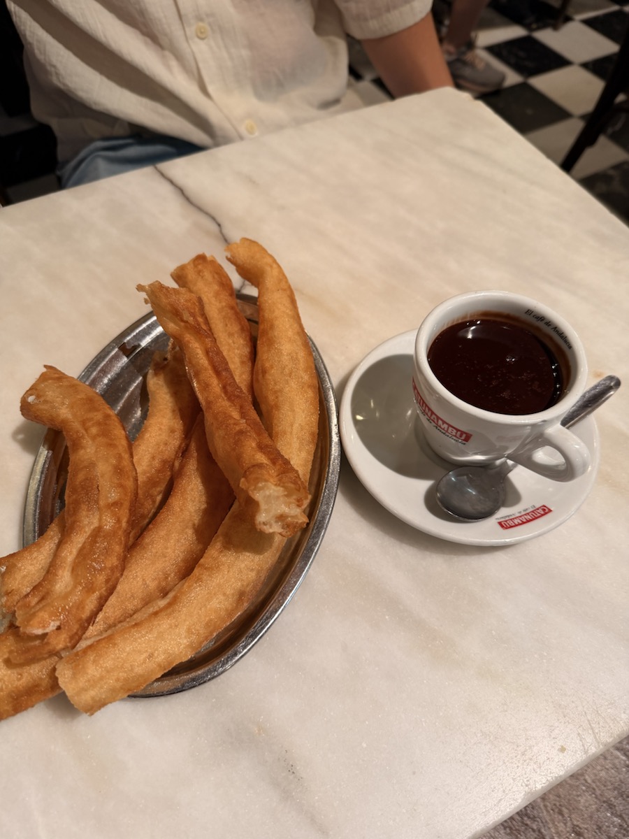Churros with a cup of thick hot chocolate at Bar El Comercio in Seville