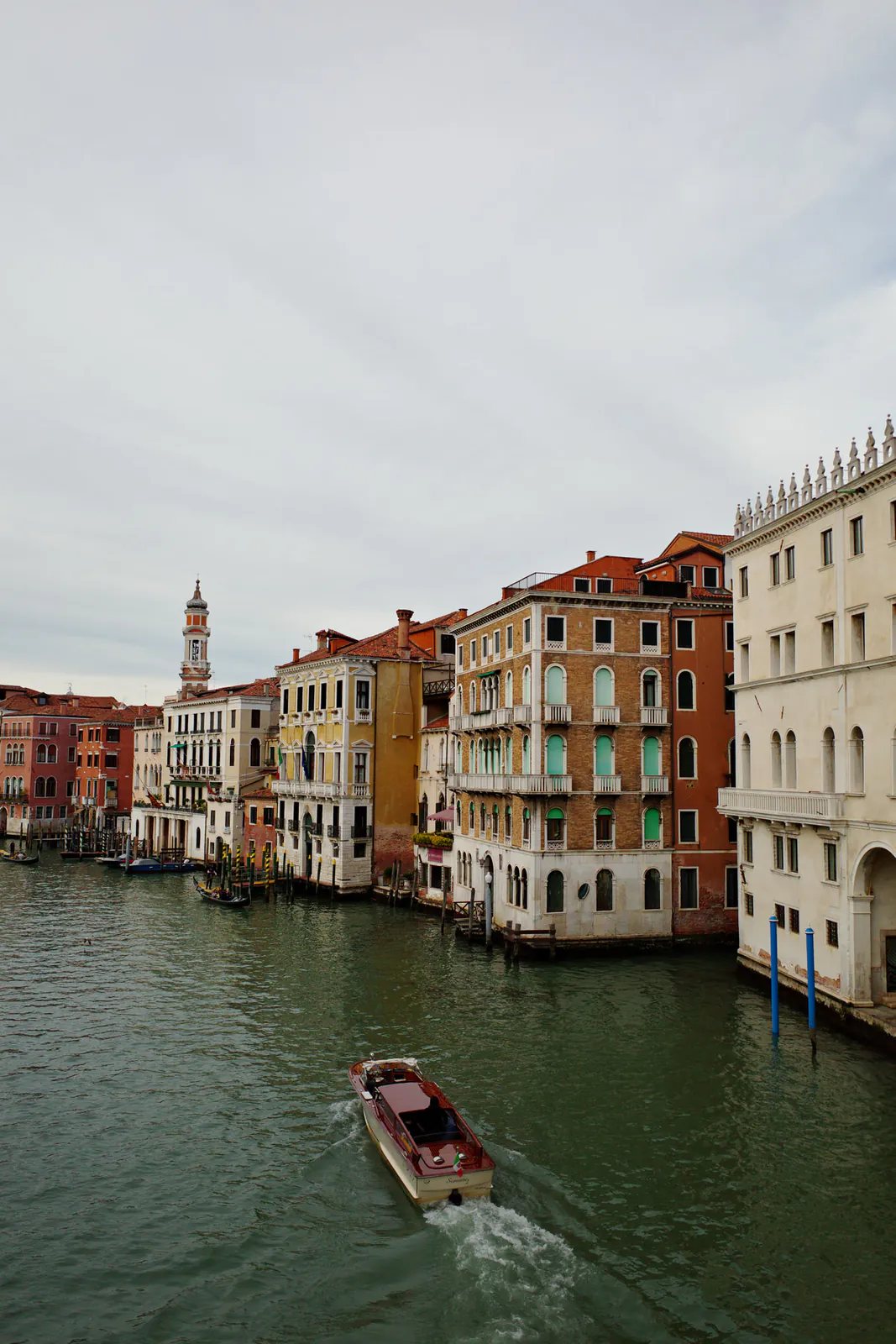 Colorful buildings lining the Grand Canal near Rialto Bridge in Venice