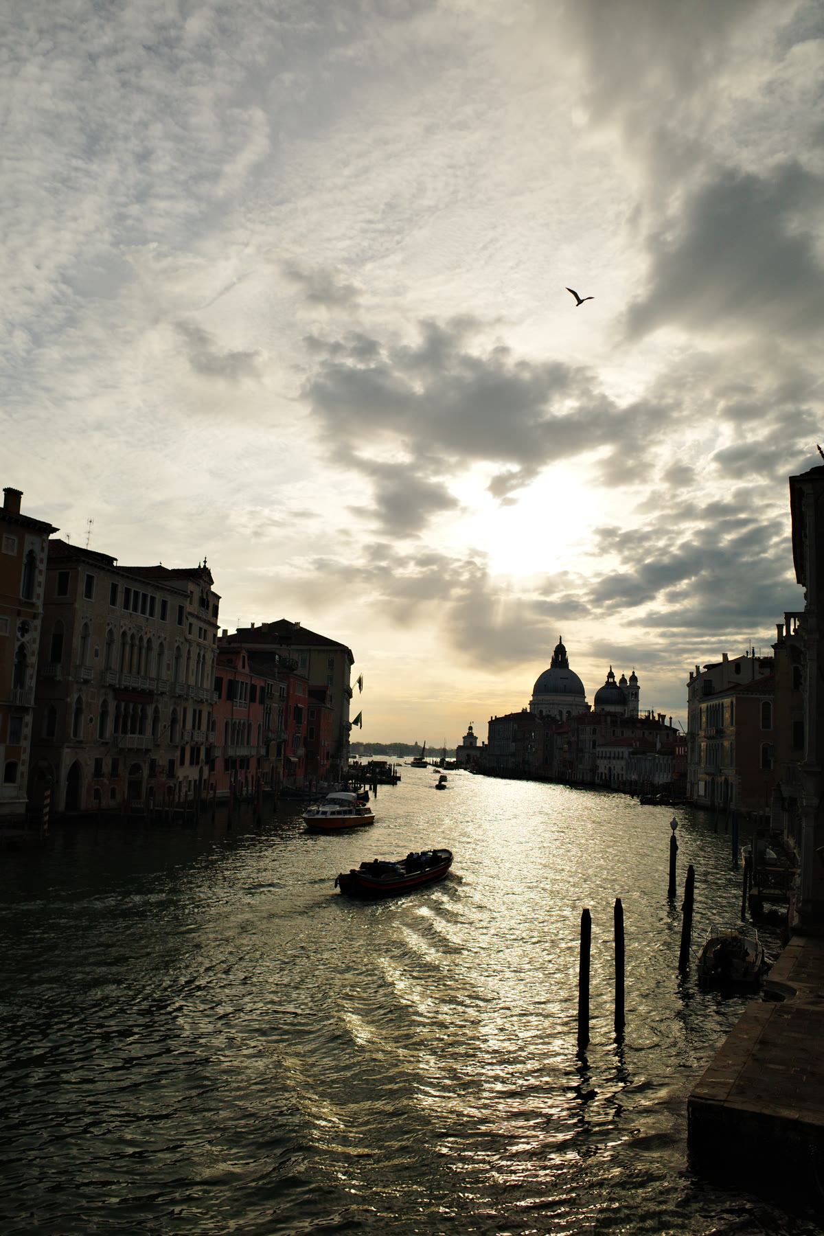 Venice canal and domed church silhouetted in the evening light